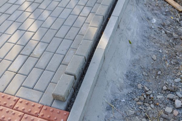 laying-paving-stones-on-the-footpath-repair-of-pe-2024-12-01-14-32-44-utc-min